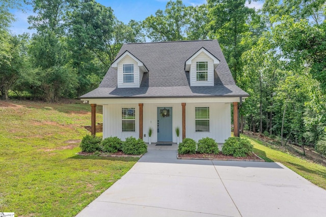 216 Country Gln, Pelzer, SC 29669 - view of front facade with a porch, a front lawn, and a shingled roof