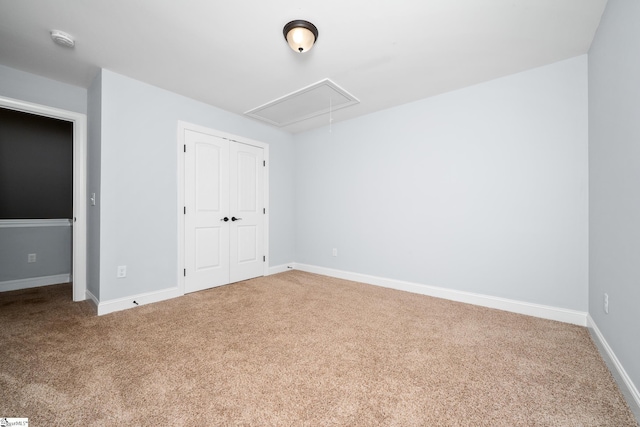 216 Country Gln, Pelzer, SC 29669 - unfurnished bedroom featuring attic access, carpet flooring, a closet, and baseboards