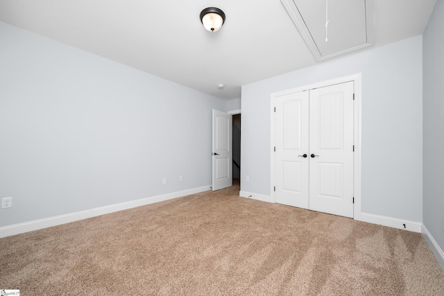 216 Country Gln, Pelzer, SC 29669 - unfurnished bedroom with attic access, carpet floors, baseboards, and a closet