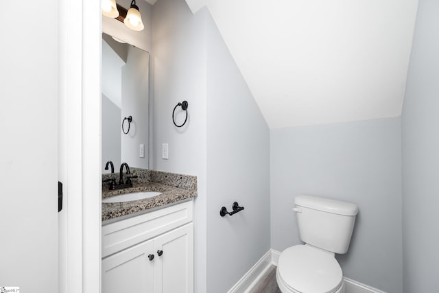 216 Country Gln, Pelzer, SC 29669 - half bath with lofted ceiling, vanity, toilet, and baseboards