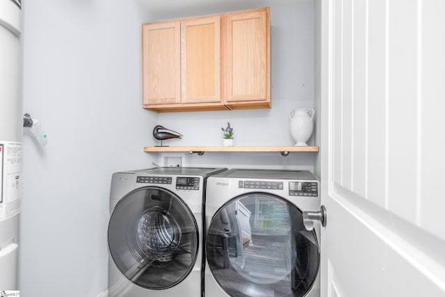 216 Country Gln, Pelzer, SC 29669 - laundry area featuring washer and dryer and cabinet space