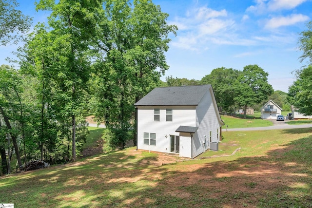 216 Country Gln, Pelzer, SC 29669 - rear view of property featuring central AC, a lawn, and roof with shingles