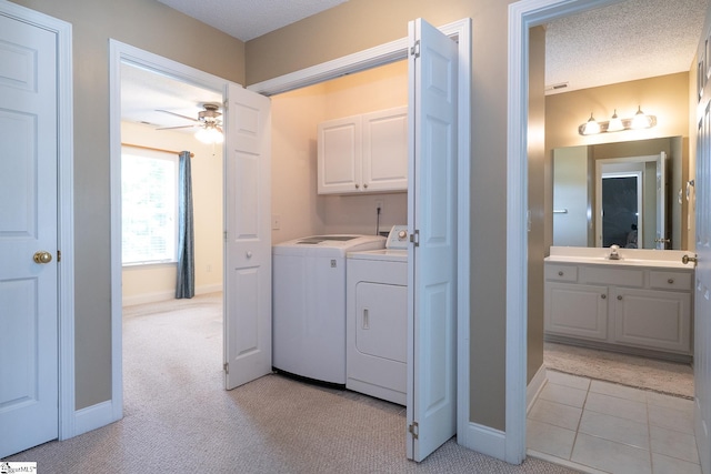 14 Saint Thomas Ct, Greer, SC 29651 - washroom with washing machine and dryer, cabinet space, ceiling fan, light colored carpet, and baseboards