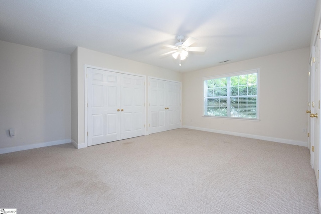 14 Saint Thomas Ct, Greer, SC 29651 - unfurnished bedroom featuring multiple closets, light colored carpet, and baseboards