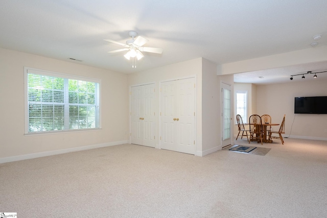 14 Saint Thomas Ct, Greer, SC 29651 - carpeted living area with a ceiling fan, plenty of natural light, and baseboards