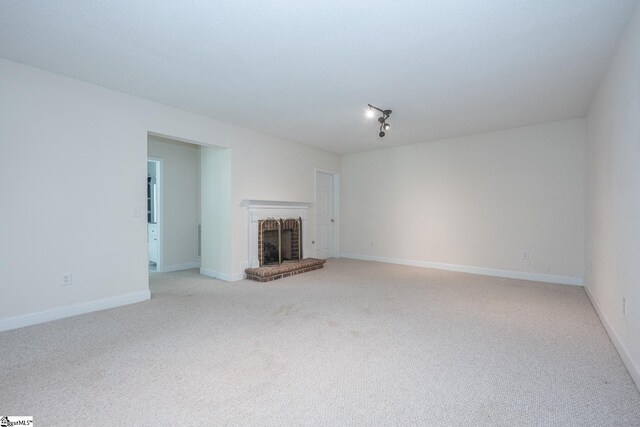 14 Saint Thomas Ct, Greer, SC 29651 - unfurnished living room with light carpet, a fireplace, and baseboards