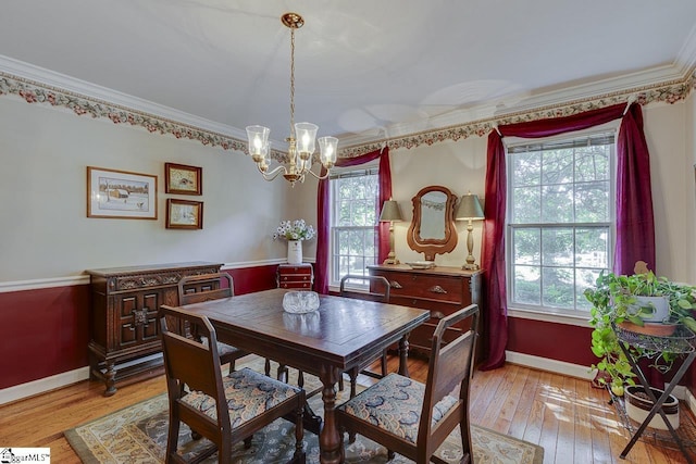 101 N Lady Slipper Ln, Greer, SC 29650 - dining area featuring baseboards, a chandelier, crown molding, and light wood-style floors