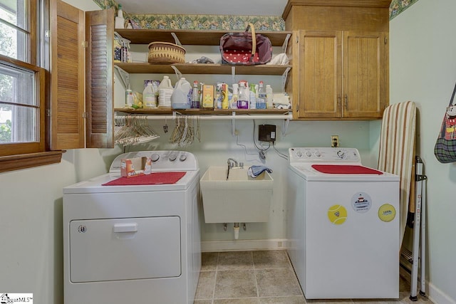 101 N Lady Slipper Ln, Greer, SC 29650 - laundry area featuring cabinet space, washing machine and clothes dryer, and baseboards