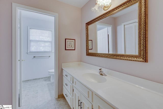 101 N Lady Slipper Ln, Greer, SC 29650 - bathroom with vanity, toilet, and a chandelier