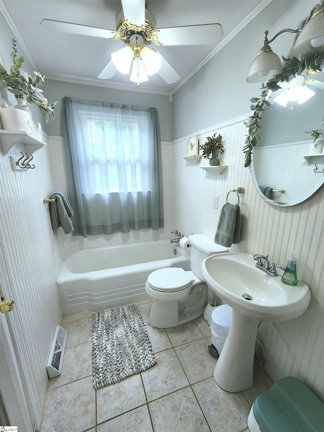 1104 Robert P Jeanes Rd, Easley, SC 29640 - bathroom featuring toilet, a bath, tile patterned floors, ceiling fan, and a wainscoted wall