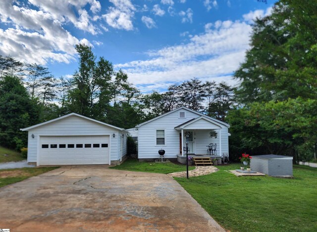 1104 Robert P Jeanes Rd, Easley, SC 29640 - view of front facade with a detached garage, a front yard, covered porch, and an outdoor structure