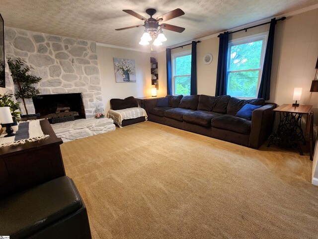 1104 Robert P Jeanes Rd, Easley, SC 29640 - carpeted living room with ceiling fan, ornamental molding, a textured ceiling, and a stone fireplace