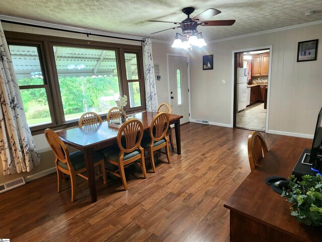 1104 Robert P Jeanes Rd, Easley, SC 29640 - dining room featuring a ceiling fan, crown molding, light wood finished floors, and baseboards
