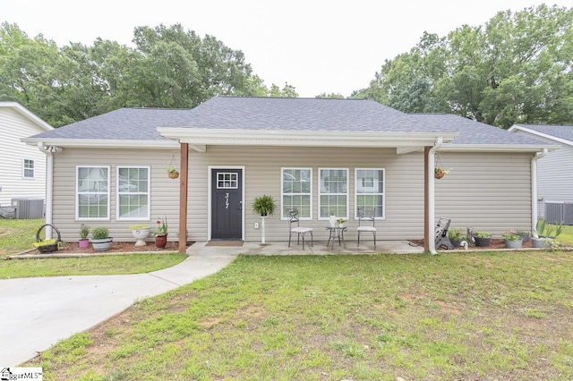 317 Saluda St, Belton, SC 29627 - bungalow featuring cooling unit, a front yard, and a shingled roof