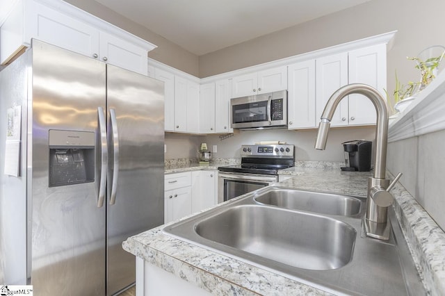 317 Saluda St, Belton, SC 29627 - kitchen featuring appliances with stainless steel finishes, white cabinetry, and light countertops