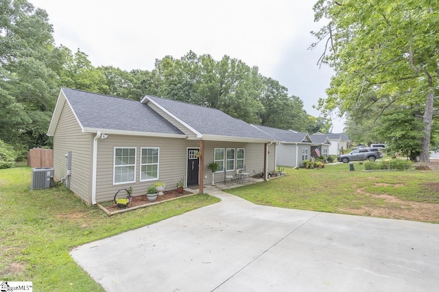 317 Saluda St, Belton, SC 29627 - single story home featuring a shingled roof, a front yard, and central air condition unit