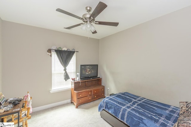 317 Saluda St, Belton, SC 29627 - bedroom with light carpet, baseboards, and a ceiling fan