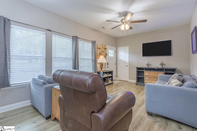 317 Saluda St, Belton, SC 29627 - living area featuring ceiling fan, plenty of natural light, baseboards, and light wood finished floors