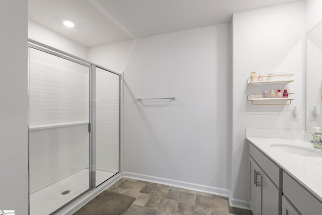 206 Bonifay Dr, Fountain Inn, SC 29644 - bathroom with vanity, baseboards, a shower with door, stone finish floors, and recessed lighting