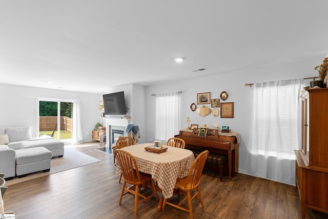 206 Bonifay Dr, Fountain Inn, SC 29644 - dining space with a fireplace with flush hearth, hardwood / wood-style flooring, and recessed lighting