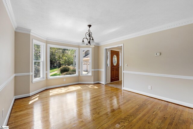 28 Bernwood Dr, Taylors, SC 29687 - foyer entrance with a chandelier, wood finished floors, baseboards, and crown molding