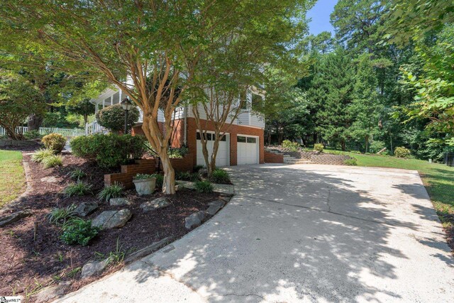 28 Bernwood Dr, Taylors, SC 29687 - obstructed view of property with driveway, an attached garage, and brick siding
