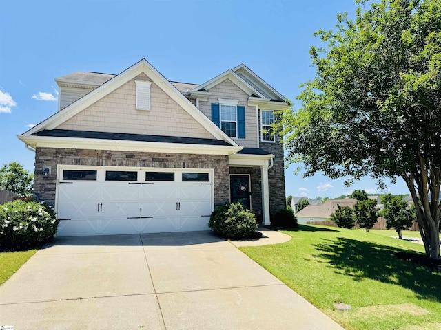 200 Odie Dr, Simpsonville, SC 29681 - craftsman-style home featuring concrete driveway, a front yard, stone siding, and a garage