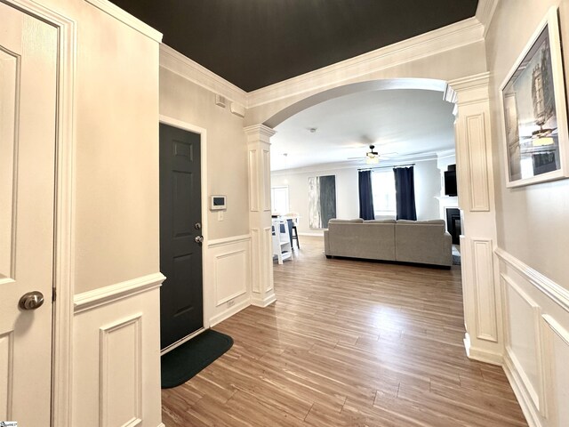 200 Odie Dr, Simpsonville, SC 29681 - entryway with decorative columns, arched walkways, crown molding, ceiling fan, and a decorative wall