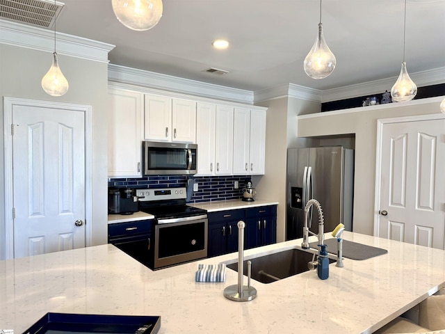 200 Odie Dr, Simpsonville, SC 29681 - kitchen with appliances with stainless steel finishes, ornamental molding, white cabinetry, a sink, and tasteful backsplash