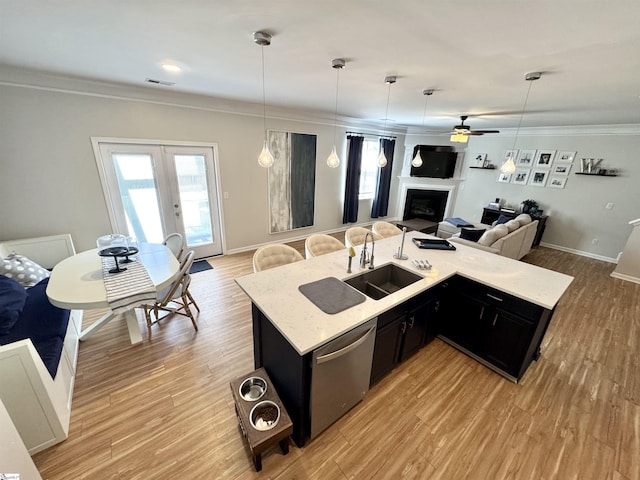 200 Odie Dr, Simpsonville, SC 29681 - kitchen featuring a sink, open floor plan, dark cabinetry, dishwasher, and crown molding