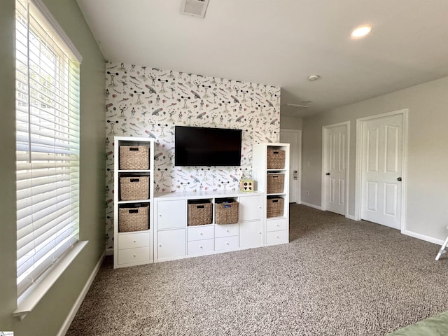 200 Odie Dr, Simpsonville, SC 29681 - unfurnished living room featuring plenty of natural light, baseboards, and carpet