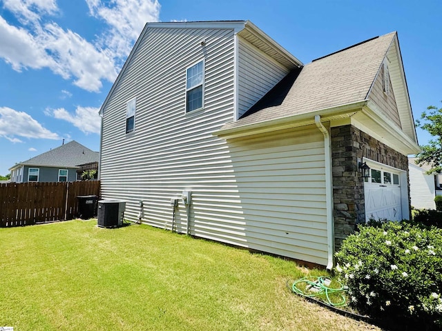 200 Odie Dr, Simpsonville, SC 29681 - view of property exterior with cooling unit, stone siding, a garage, and a shingled roof