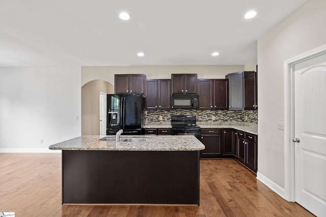 239 Applehill Way, Simpsonville, SC 29681 - kitchen featuring black appliances, a sink, tasteful backsplash, dark brown cabinets, and light stone countertops