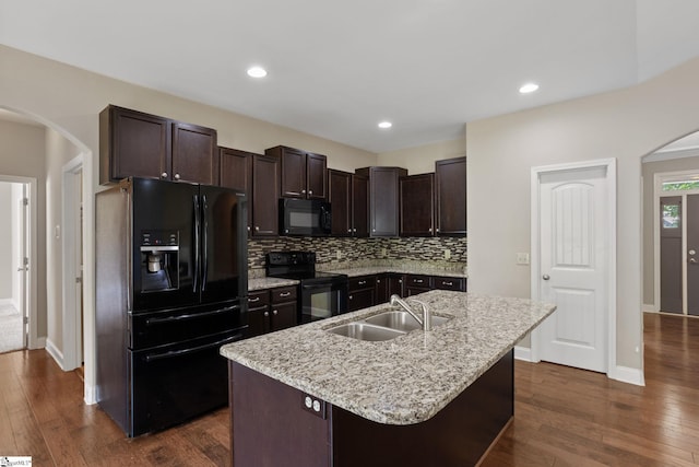 239 Applehill Way, Simpsonville, SC 29681 - kitchen with black appliances, arched walkways, a sink, dark wood-style floors, and recessed lighting