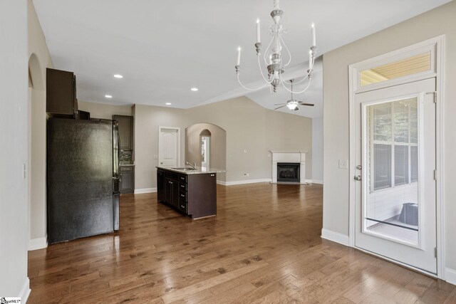 239 Applehill Way, Simpsonville, SC 29681 - kitchen with freestanding refrigerator, a sink, a fireplace, open floor plan, and ceiling fan