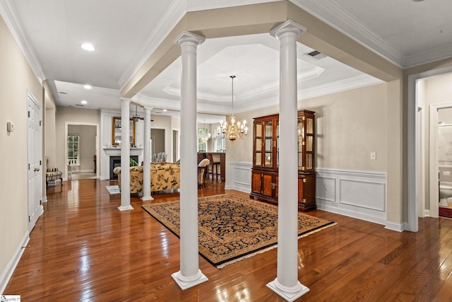 27 Grossmont Dr, Fountain Inn, SC 28644 - entrance foyer with hardwood / wood-style flooring, ornate columns, wainscoting, a fireplace, and ornamental molding