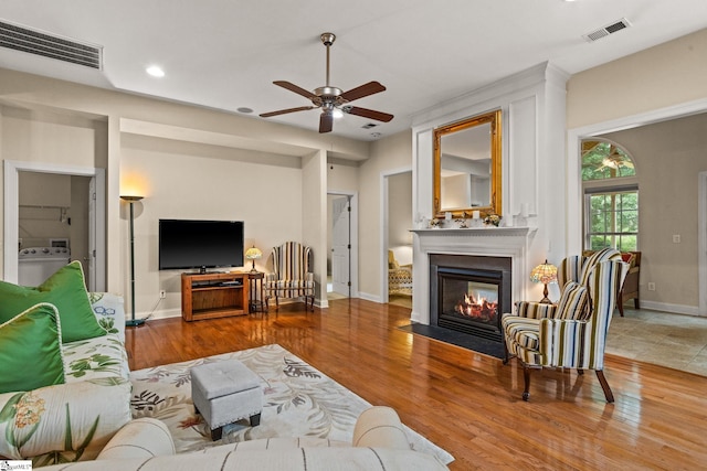 27 Grossmont Dr, Fountain Inn, SC 28644 - living room with ceiling fan, a multi sided fireplace, wood finished floors, recessed lighting, and baseboards