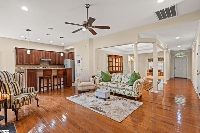 27 Grossmont Dr, Fountain Inn, SC 28644 - living area featuring ornate columns, light wood-style flooring, ceiling fan, recessed lighting, and ornamental molding