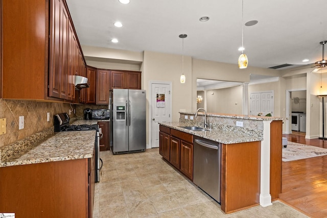 27 Grossmont Dr, Fountain Inn, SC 28644 - kitchen featuring appliances with stainless steel finishes, a sink, ventilation hood, tasteful backsplash, and recessed lighting