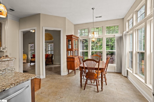 27 Grossmont Dr, Fountain Inn, SC 28644 - dining area with healthy amount of natural light, a chandelier, and baseboards