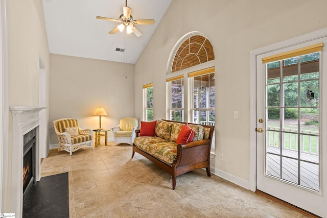 27 Grossmont Dr, Fountain Inn, SC 28644 - living room with plenty of natural light, a fireplace with flush hearth, a ceiling fan, baseboards, and high vaulted ceiling