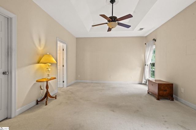 27 Grossmont Dr, Fountain Inn, SC 28644 - spare room with a tray ceiling, carpet flooring, ceiling fan, and baseboards