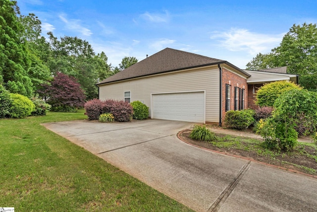 27 Grossmont Dr, Fountain Inn, SC 28644 - view of side of home featuring a lawn, driveway, brick siding, a garage, and a shingled roof