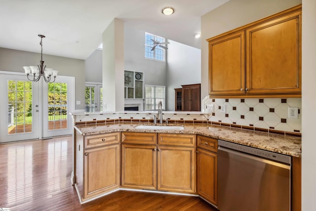 1073 Corie Crest Dr, Boiling Springs, SC 29316 - kitchen featuring dishwasher, a sink, a chandelier, and light stone counters