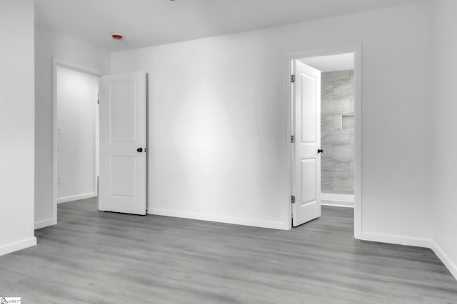 182 Ridge St, Spartanburg, SC 29302 - unfurnished room with baseboards, wood finished floors, and a smoke detector