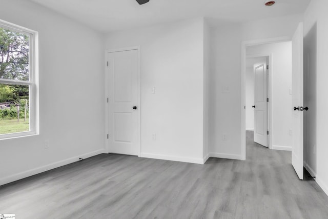 182 Ridge St, Spartanburg, SC 29302 - unfurnished bedroom with light wood-type flooring and baseboards