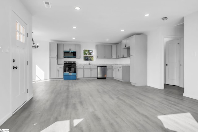 182 Ridge St, Spartanburg, SC 29302 - kitchen with electric stove, stainless steel dishwasher, gray cabinets, light countertops, and recessed lighting
