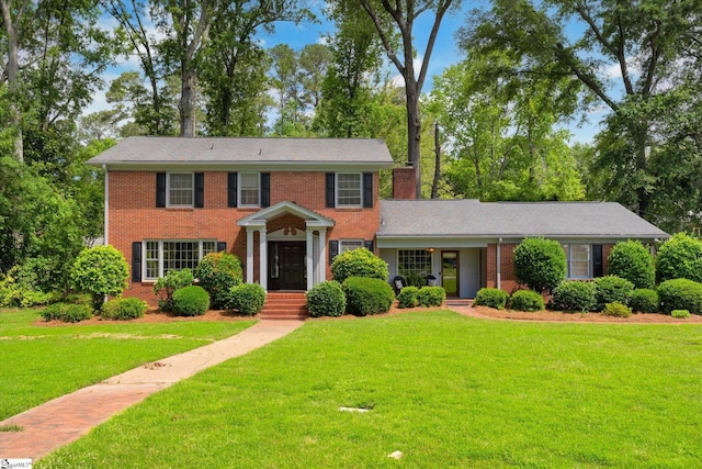302 Spruce St, Clinton, SC 29325 - colonial house with brick siding and a front lawn