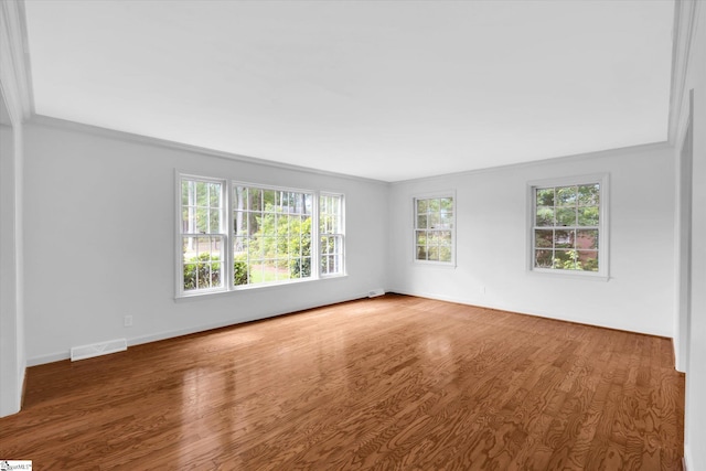 302 Spruce St, Clinton, SC 29325 - unfurnished room with wood finished floors, crown molding, and baseboards