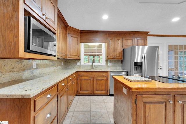 302 Spruce St, Clinton, SC 29325 - kitchen with appliances with stainless steel finishes, wooden counters, a sink, brown cabinetry, and ornamental molding